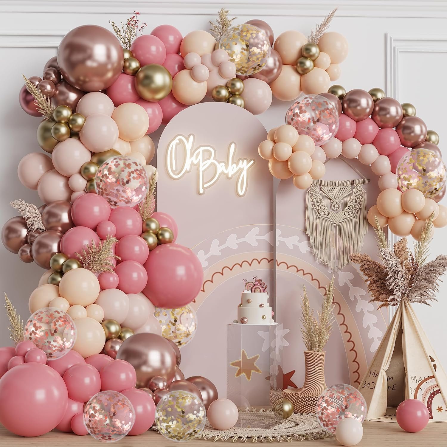 Rose gold, blush pink, and metallic gold balloon garland arch decorating a wedding aisle