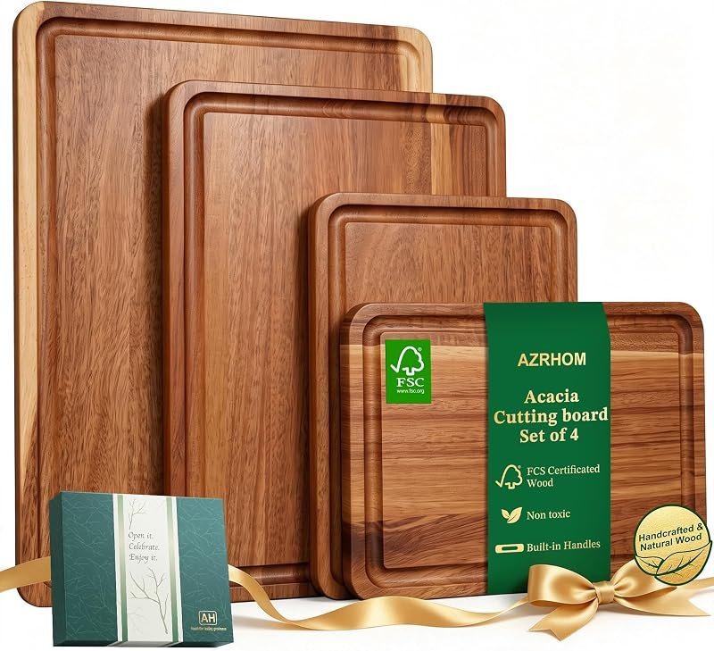 Set of four acacia wooden cutting boards with juice grooves and brand sleeve