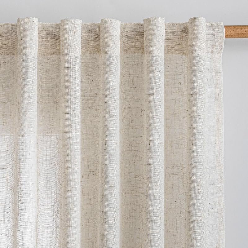Natural semi-sheer linen curtain panels hanging on a wooden rod